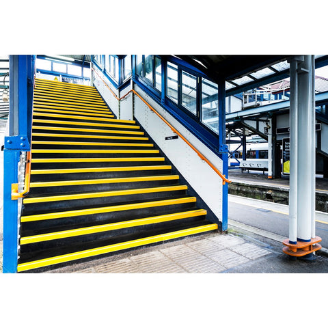GRP Anti Slip Stair Tread Covers on train station stairs